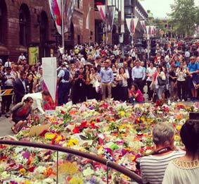 people mourn the victims of sydney attack